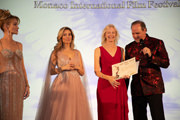 The Best Humanitarian Angel Film Award goes to “THE PERFECT LOVE” (US)…Huge Congratulations to Writer and Producer Kevin Foster and Kim Holland on stage in Monaco all smiles and happiness