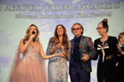 Huge Congrats to the Winner for Best Movie “KING OF KINGS: Chasing Edward Jones” receiving the 2023 Angel Film Awards Trophy, on stage Director Harriet Marin Jones holding her Angel full of joy