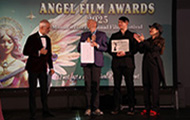 Jury President Toma Enache on stage with the Winners feature film Pluess, Nina Iseli, Raphael Sommer, Martin Albisetti